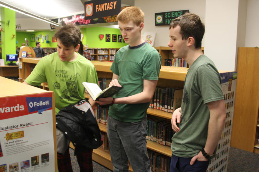 Seniors Gabe Corbitt, Austin Marlar and Dan Keywork browse the library in their old elementary school.
