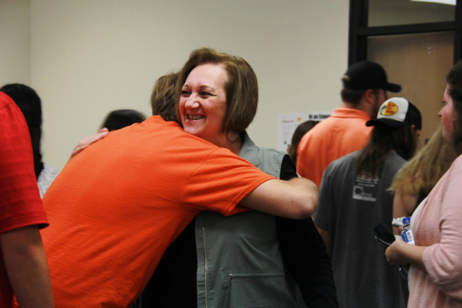 Senior Hunter Broughton and Debbie Noble embrace at Hart Elementary. 
