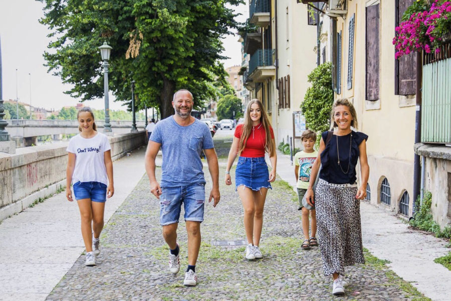 Junior Asia Segattini (third from left) walks with her family in Verona, Italy. Segattini hasnt seen her family since leaving to be an exchange student on Aug. 1, 2018. She returns home next week.