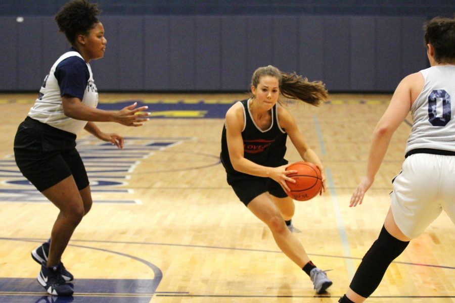 Senior Grace Bennet drives into the lane for a layup at the fall ball basketball game against Wylie East, a district opponent.