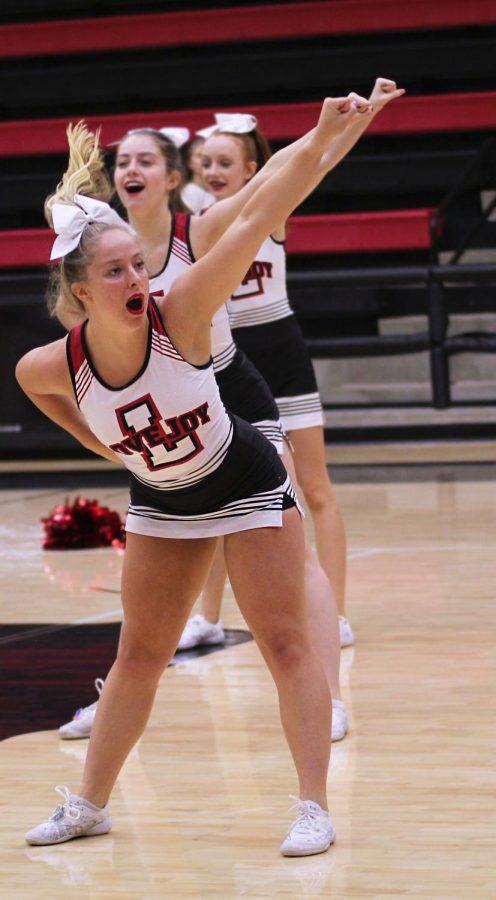 Senior cheerleader Madison Kohl cheers at the incoming freshmens first pep rally.