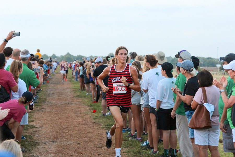 Senior Will Muirhead runs toward the finish line during the cross country meet on Saturday, Aug. 31. Muirhead placed 11th overall running 3.1 miles with a time of 15:37.40.
