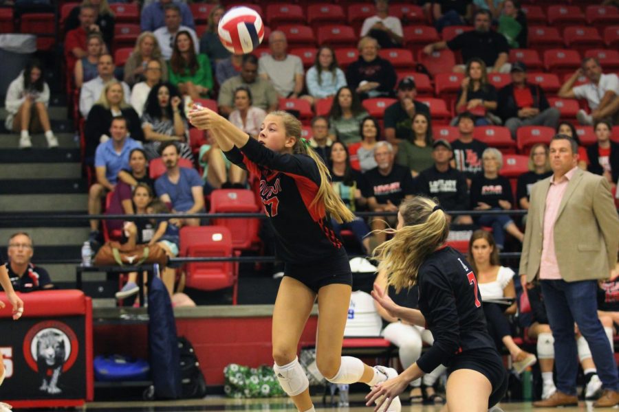 Sophomore Rosemary Archer passes the ball up to help her team rally despite a 26-28 loss in the second match.