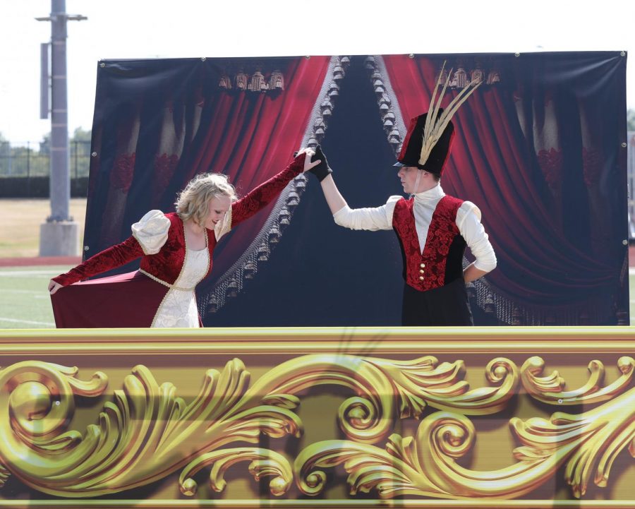 Sophomore Landry Diercks and senior Collin Thomson dance during part two of the bands show entitled “Juliet” at the Wylie Invitational. The band will compete at the area competition on Saturday.