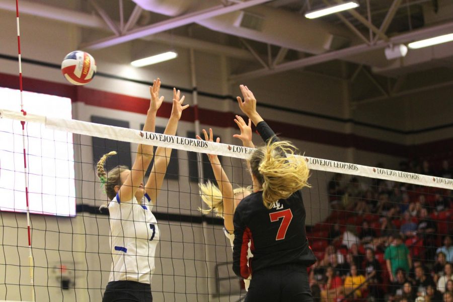 Junior Ellie Jonke spikes the ball over a Byron Nelson defender.