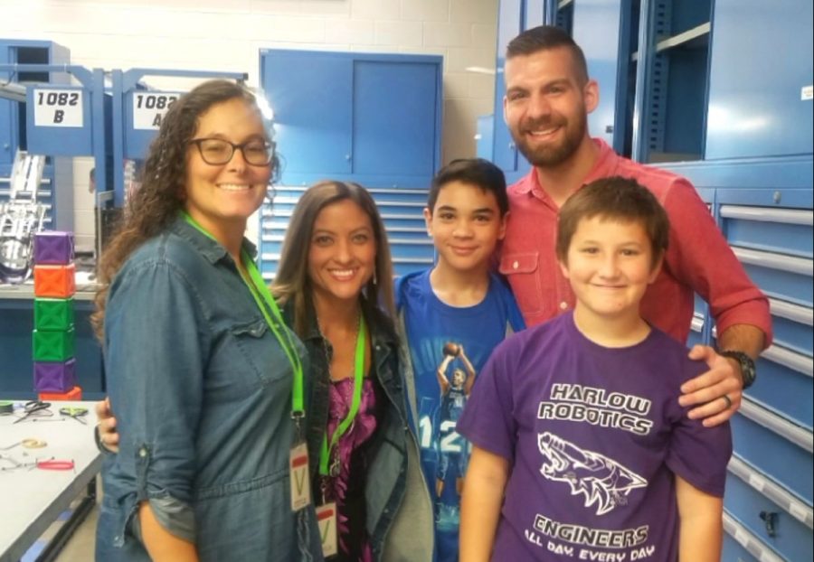 Kristen Harkless and Joanne French stand with their children and former students of Josh Strickland. After teaching the two students in Anna ISD, Strickland won for Teacher of the Month from Good Morning Texas.