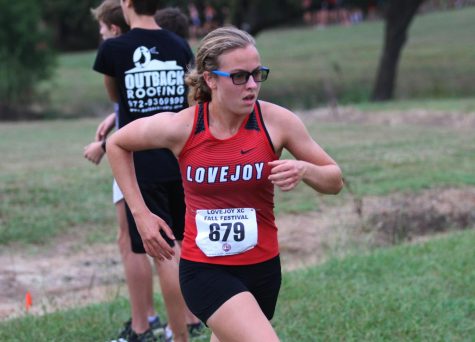 Junior Amelia Carothers runs in the Lovejoy Cross Country Fall Festival at Myers Park. 