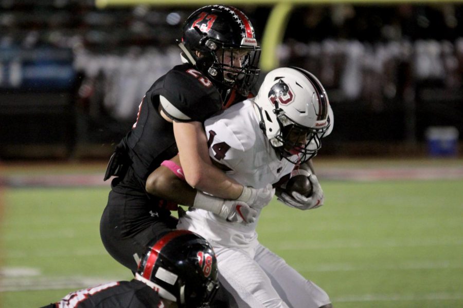 Sophomore Dillon Magee goes in for a tackle on a Princeton ball carrier.