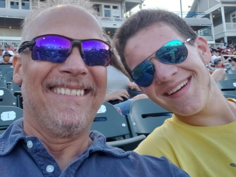 David and Justin Maroney smile prior to a Frisco Rough Riders baseball game in May. 