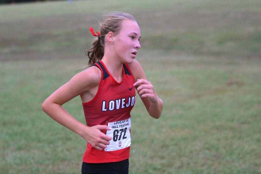 Sophomore Katie Armstrong races at the Lovejoy Fall Festival on Sept. 21. Armstrong finished the race with a time of 19:53. 