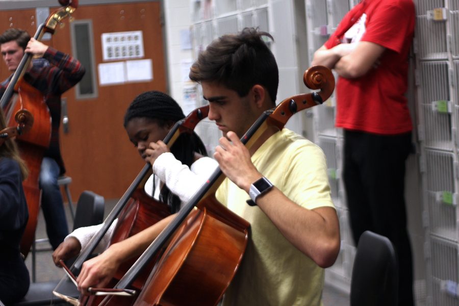 Junior+Grayson+Mousavijam+and+Freshman+Simi+Fadel+practice+their+cellos+in+preparation+for+their+annual+courtyard+concert+this+Monday%2C+October+28th.+They+will+be+playing+festive+halloween+music.%0A