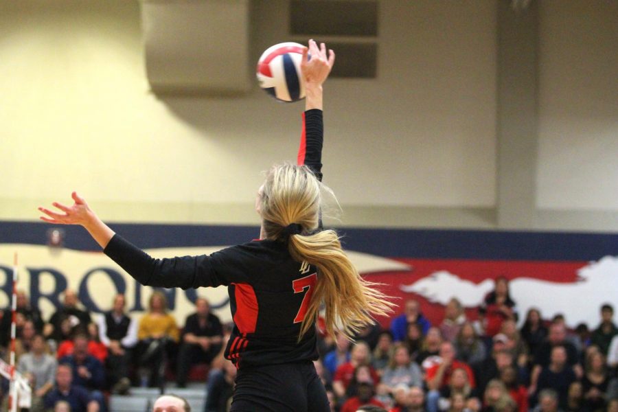 Junior Ellie Jonke hits the ball from the outside hitter position to Liberty’s Libero, scoring a point for Lovejoy. 
