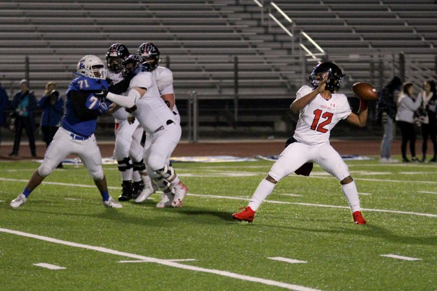 Sophomore Noah Naidoo throws the ball to wide receiver Bo Allen. Naidoo filled in as the quarterback for Ralph Rucker in this game.