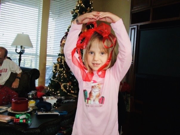 Editor-In-Chief Madeline Sanders dances with ribbon around her head on Christmas day in 2010. 