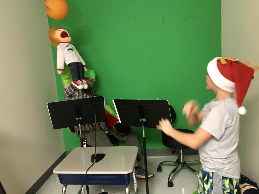 A puppet is hit with a ball during a practice taping of the newest episode. The series played during announcements, discusses topics such as respect and responsibility. 