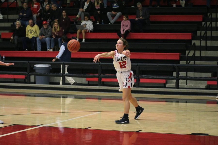 Senior point guard Mallory Adamson makes an outlet pass in her own end of the court.