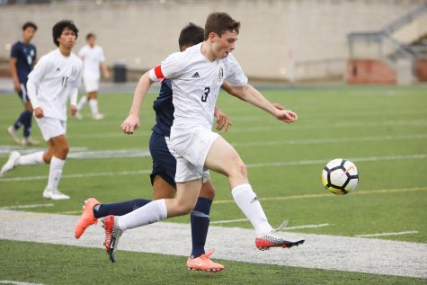 Junior Michael Myers takes possession of the ball during the first half of the game against Allen.