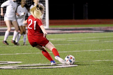Freshmen Callan Snider take a free kick at the 20-yard-line. She misses the shot blocked by The Colony's goalie.