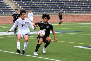 Senior Diego Rodriguez fights for possession of the ball. 