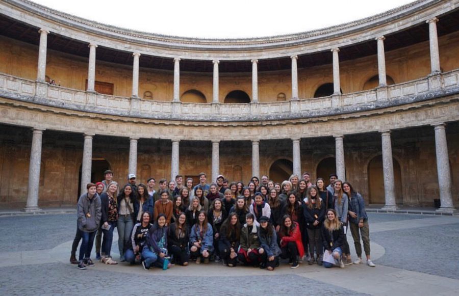 Students on the 2019 trip abroad to Spain pose in the Charles V palace of the Alhambra.