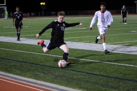 Senior Jake McTee passes the ball in order to keep it away from the other team. The team beat Sherman in overtime. 