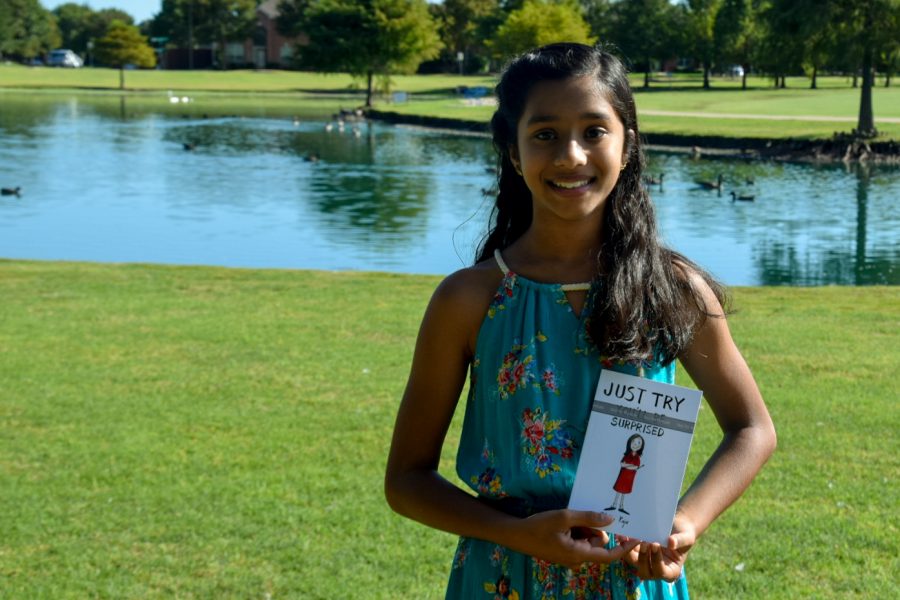 Fifth-grader, Venya Raju, is a published author of Just Try: Youll be surprised. Venya has the draft copy of her book, and is excited for the upcoming public release.