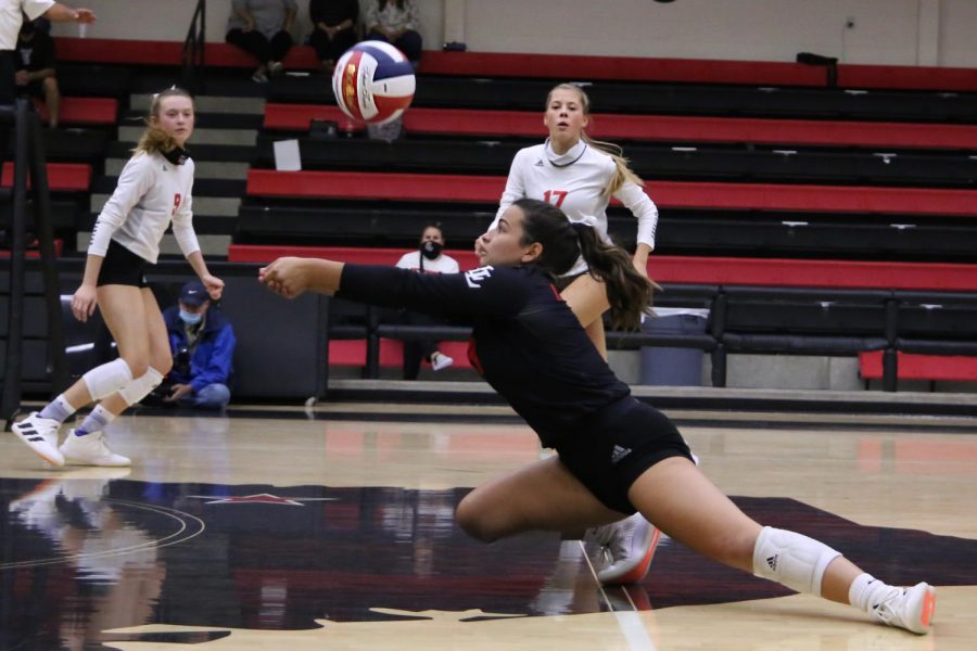 Senior Callie Kemohah makes a dig to save the ball. The Leopards won this game in three sets. 