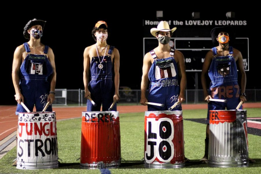 Senior Gavin Goodrich, junior Derek Dang, senior Sam Clay, and senior Peter Godipelly are four out of the five Dirty Drumline members this year. Besides senior Triton Freels, the four led the students at the football scrimmage yesterday.