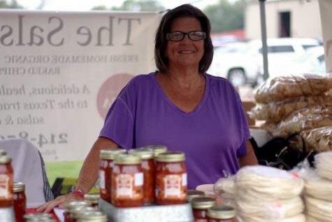 Stephanie Canada stands behind The Salsa Texans products for sale at the Lucas Farmers Market. She is one of a few sales representatives around the area for The Salsa Texan.