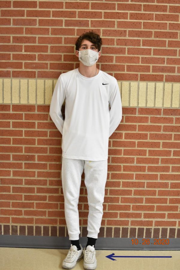 Freshmen Colgin Pettit wears all white for the first day of homecoming week. Many freshmen are taking part in dress up days for their first year of homecoming. 
