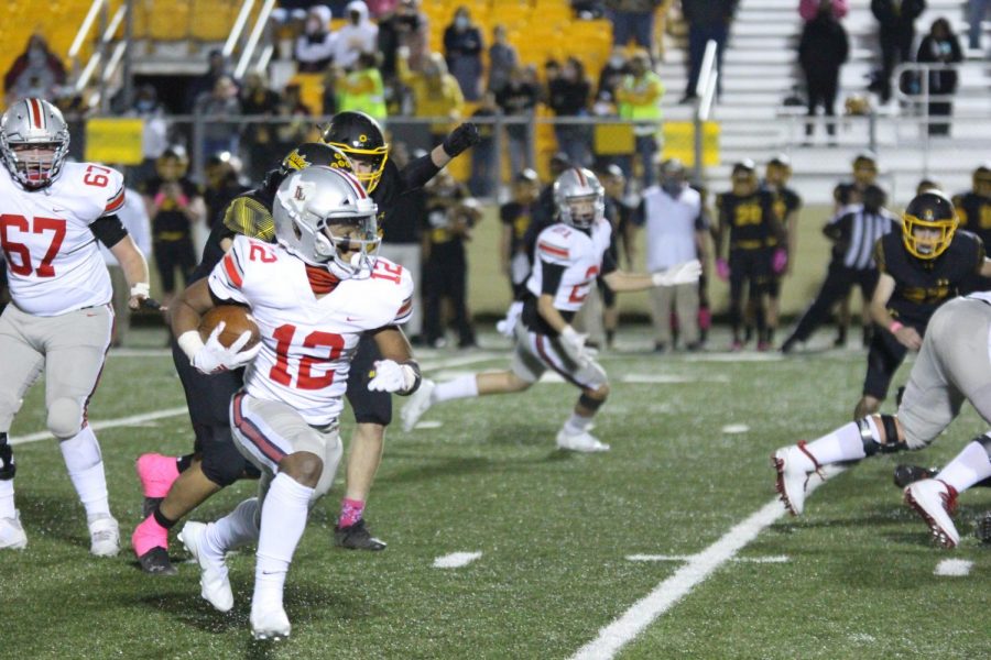 Junior running back Noah Naidoo runs the ball for a gain of twenty yards. This run put the Leopards at first and goal to set up a touchdown by senior receiver Luke Mayfield.

