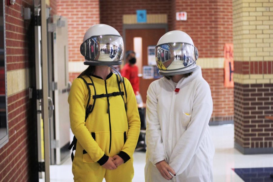 Seniors Alex Perry and Rachel Drew wear Among Us themed space costumes. Their costumes featured astronaut helmets. 