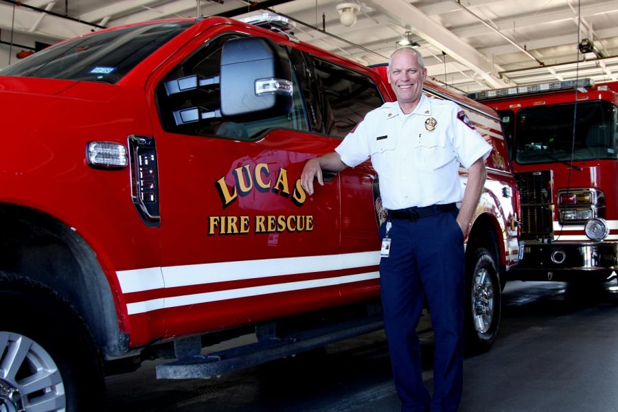 Lucas+fire+chief+Ted+Stevens+stands+with+one+of+their+trucks+at+the+station.+Stevens+was+previously+a+high+school+business+teacher+for+18+years.+