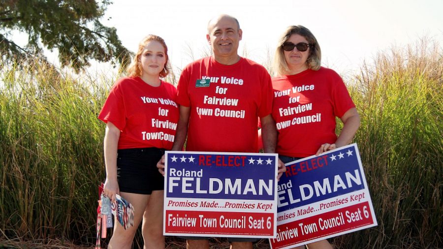 Roland+Feldman+stands+with+his+daughter%2C+senior+Ariel+Feldman%2C+and+wife+Fiana+Feldman.+Feldman+is+running+to+be+re-elected+for+Fairview+Town+Council.+