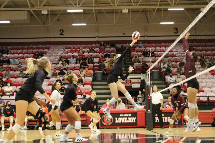 Senior Lexis Collins makes the return with a soft hit. The Leopards won the point after a long volley.