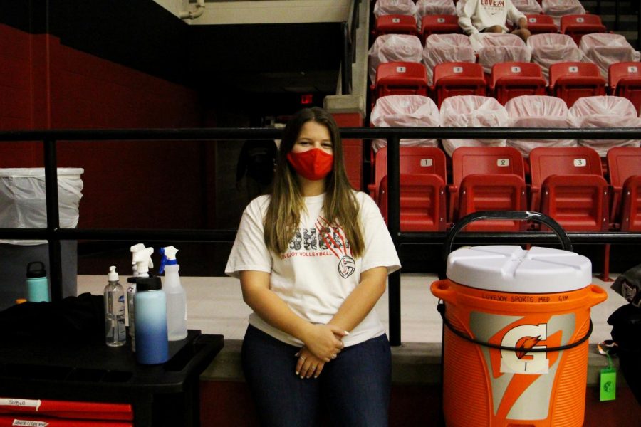 Senior Jenna Kilpatrick works as the athletic trainer at the volleyball game. "They originally started out with a joke saying that there was a practice that wasn't covered so I needed to get up there" Kilpatrick said. "Then, they told me that was fake, and I had been nominated for the scholarship."