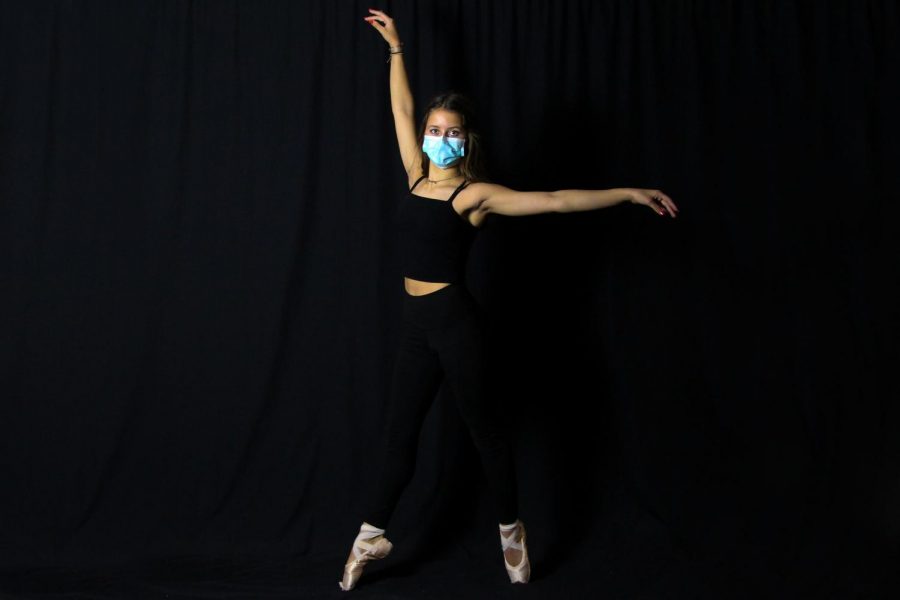 Freshmen Julie Snow dances for the Academy of Dance Arts. Snow will perform in the studios production of the Nutcracker. 