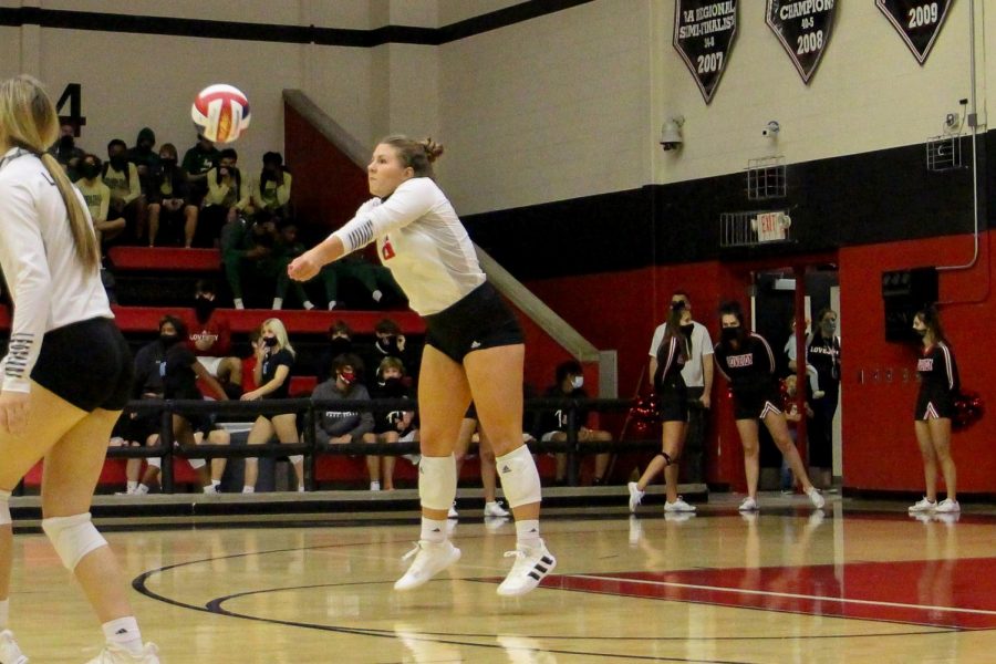 Senior Grace McLaughlin bumps the ball to make a pass. The pass allows for the return to win the Leopards the point.
