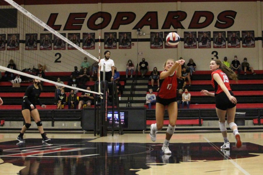 Junior Rosemary Archer bumps the ball to make the return. The Leopards win the point upon the return.