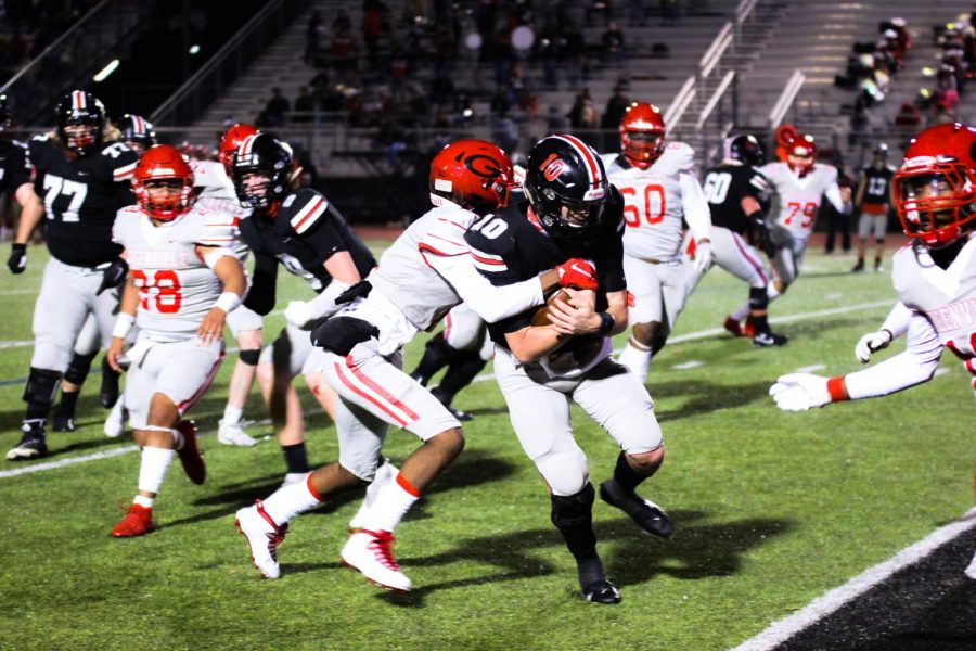 Senior quarterback Ralph Rucker presses into the endzone for a touchdown after a five yard run. The team will face off this week in the Area Championship.
