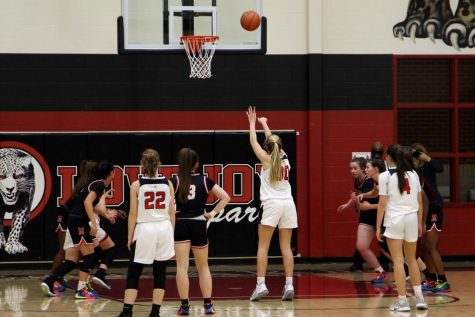 Sophomore Linnea Maddox shoots a free throw. The shot was attempted in the first half.