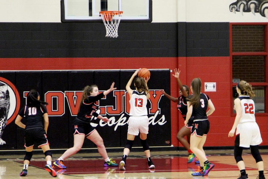 Senior Katie Dolberry attempts a shot during the first quarter. This is Katie Dolberrys first year on Varsity.