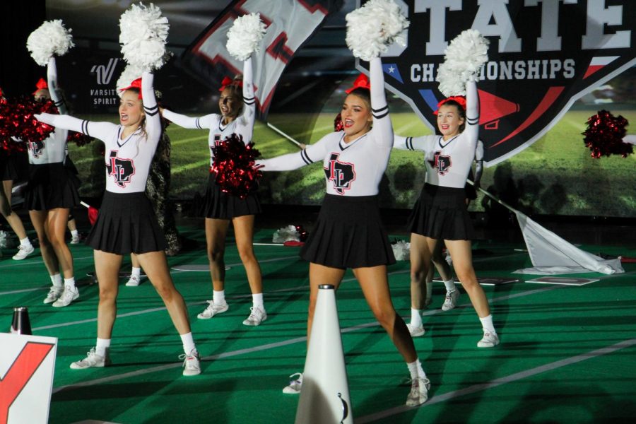 Seniors Caroline Dobbs and Trinity Tassan perform the band dance. The team got third place in the band dance category. 