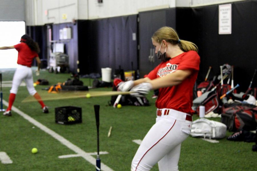 Freshmen Alyssa Morely practices batting in the indoor facility. The softball team will play Sachse and Rains on Jan. 30 in Little Elm. 