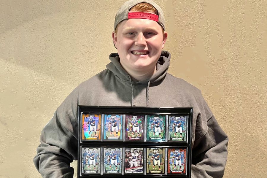 Senior Parker Braithwaite holds his favorite trading cards from his collection. Braithwaite buys and sells the cards based on how likely they are to be popular. 