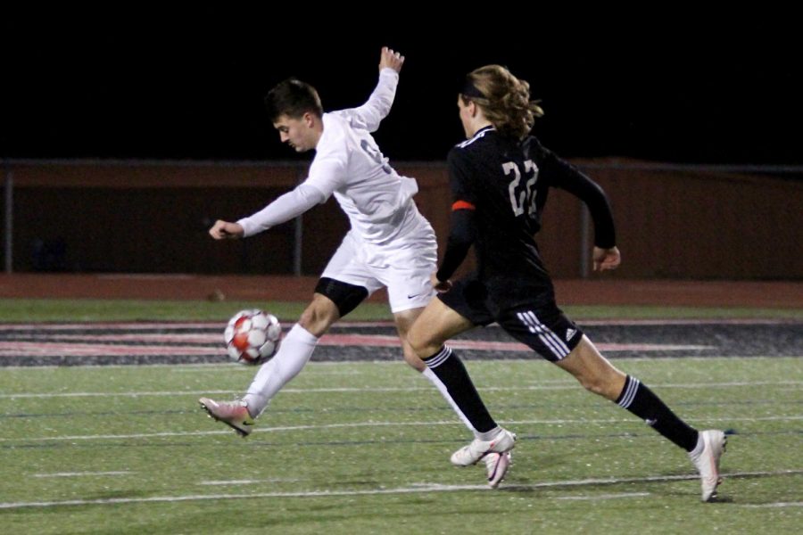 Senior forward no. 22 Cade Novicke runs to get the ball from a Wylie East defender. The soccer team will play Rock Hill on Friday night away. 