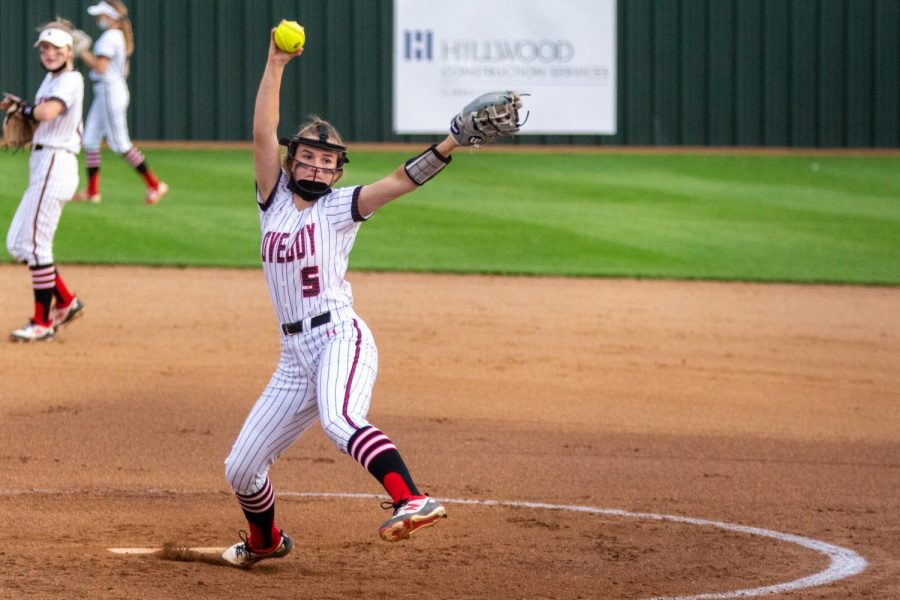 Freshmen Skylar Rucker pitches at the team's first game of the district season. The Leopards won this game with a final score of 10-2.