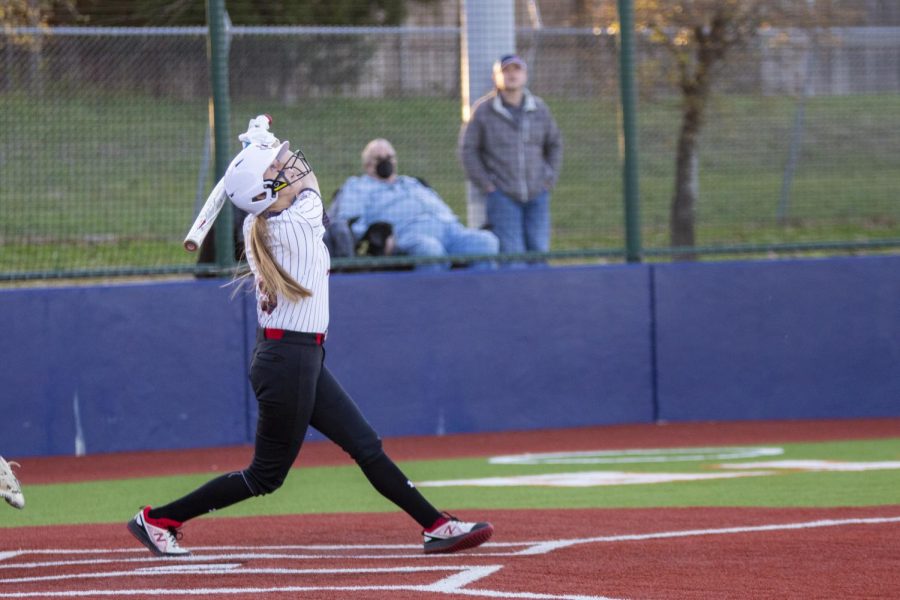 Sophomore catcher no. 3 Sydney Bardwell looks at her ball after hitting. The softball team will play prosper Rock Hill tomorrow at home. 