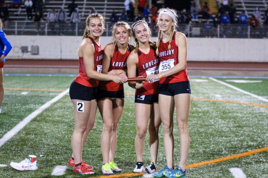 The girl’s 4x400 meter relay team, consisting of sophomores Chloe Schaeffer, Amy Morefield, Bella Landrum and freshman Kailey Littlefield,  poses for a photo after their race while waiting for awards. The team ran the race in 3:55.54 giving them the second place finish behind Lancaster.
