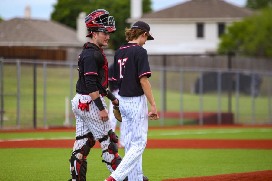 Senior catcher no. 14 Ralph Rucker and senior reliever no. 17 Cade Hill talk things over after Hill loaded the bases with no outs in the bottom of the sixth during a tied 4-4 game. Hill proceeded to go three up three down and escape the inning with no Bulldog runs.